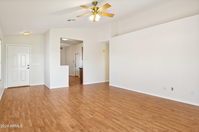 unfurnished room with light hardwood / wood-style flooring, vaulted ceiling, and ceiling fan