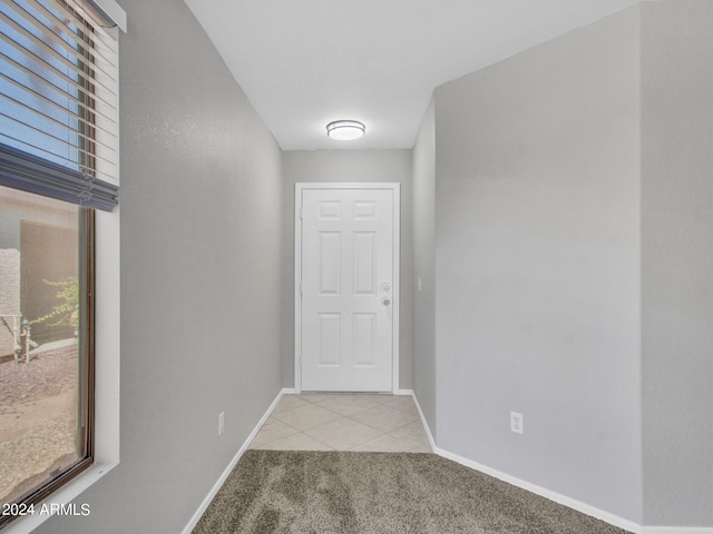 corridor with light colored carpet