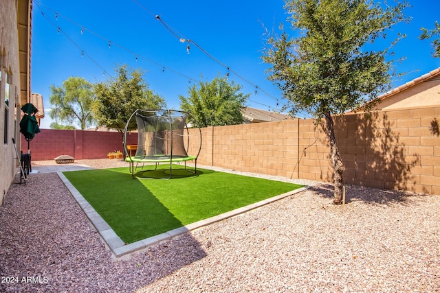 view of yard featuring a trampoline