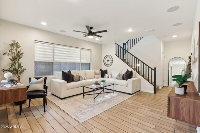 6641 N Desert Shadow Ln, Phoenix, AZ 85014 - living area with ceiling fan, light wood-style flooring, stairs, arched walkways, and recessed lighting