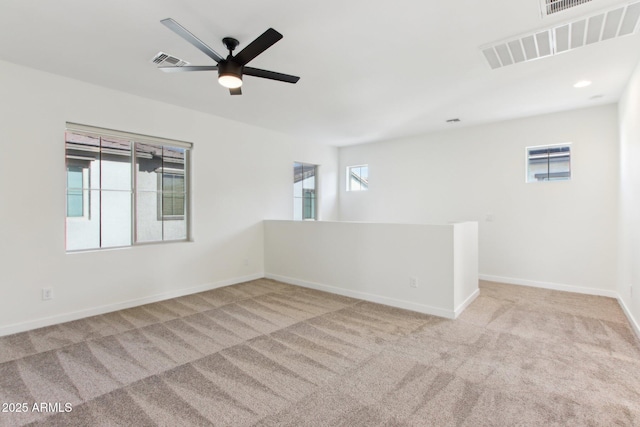 6641 N Desert Shadow Ln, Phoenix, AZ 85014 - empty room featuring carpet floors, baseboards, and ceiling fan