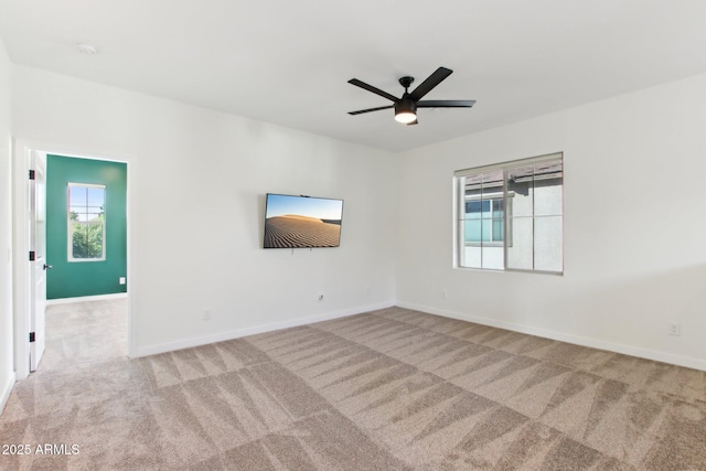 6641 N Desert Shadow Ln, Phoenix, AZ 85014 - carpeted empty room featuring a ceiling fan and baseboards