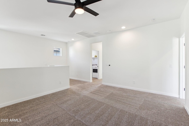 6641 N Desert Shadow Ln, Phoenix, AZ 85014 - spare room featuring ceiling fan, light colored carpet, baseboards, and recessed lighting
