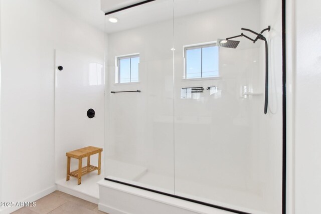6641 N Desert Shadow Ln, Phoenix, AZ 85014 - bathroom featuring a shower, tile patterned floors, and baseboards
