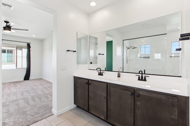 6641 N Desert Shadow Ln, Phoenix, AZ 85014 - full bath with walk in shower, healthy amount of natural light, ceiling fan, and baseboards