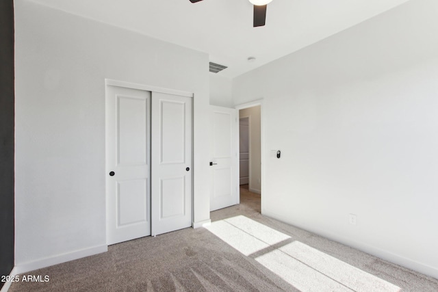 6641 N Desert Shadow Ln, Phoenix, AZ 85014 - unfurnished bedroom with carpet flooring, a closet, and a ceiling fan