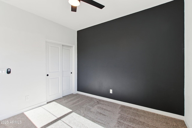 6641 N Desert Shadow Ln, Phoenix, AZ 85014 - unfurnished bedroom with carpet flooring, a closet, ceiling fan, and baseboards