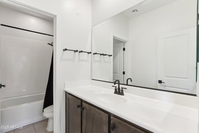6641 N Desert Shadow Ln, Phoenix, AZ 85014 - bathroom featuring toilet, tile patterned floors, vanity, and shower / tub combo with curtain