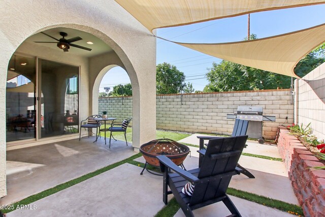 6641 N Desert Shadow Ln, Phoenix, AZ 85014 - view of patio with an outdoor fire pit, grilling area, a fenced backyard, and ceiling fan
