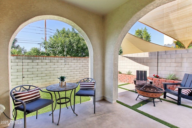 6641 N Desert Shadow Ln, Phoenix, AZ 85014 - view of patio featuring an outdoor fire pit and a fenced backyard