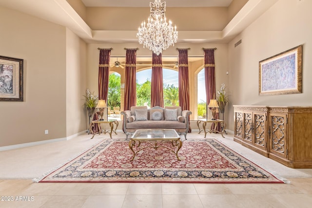 interior space featuring light tile patterned floors, a chandelier, and a high ceiling