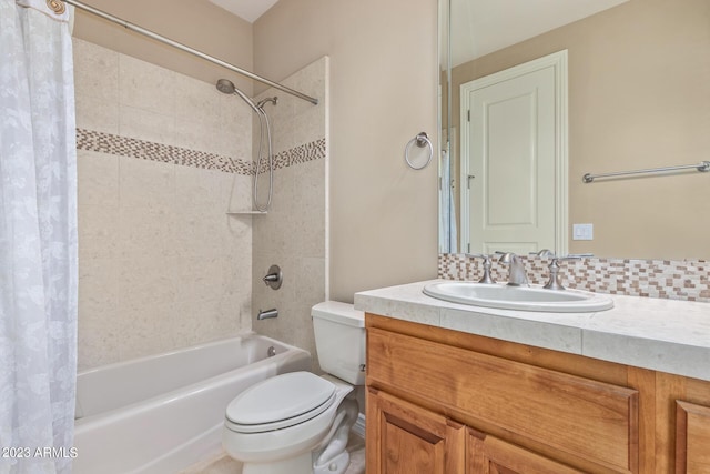 full bathroom featuring toilet, decorative backsplash, shower / tub combo, and vanity