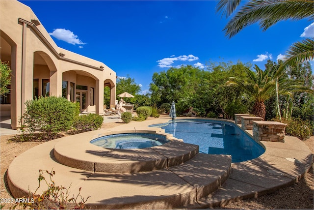 view of pool featuring an in ground hot tub and a patio