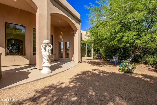 exterior space with french doors and a patio