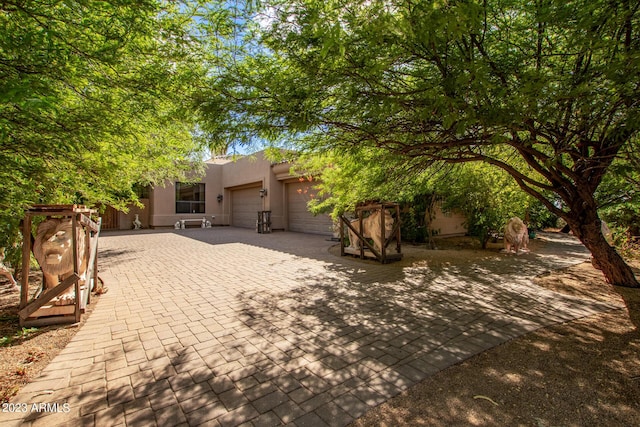 view of patio / terrace featuring a garage