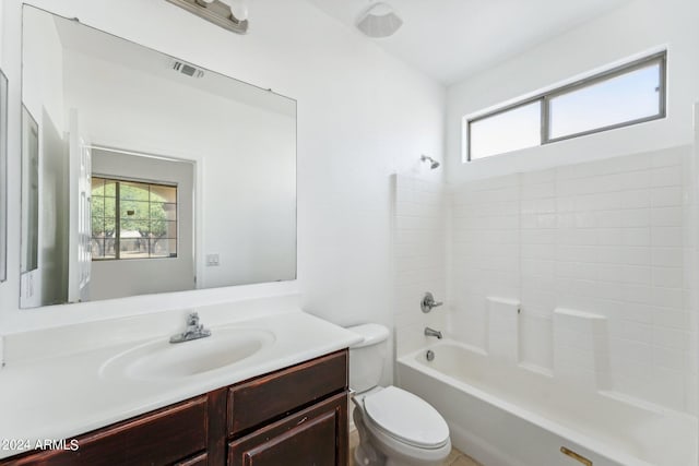 full bathroom featuring bathtub / shower combination, vanity, and toilet