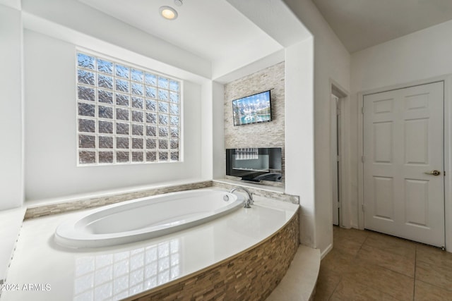 bathroom featuring tile patterned flooring and a bathtub