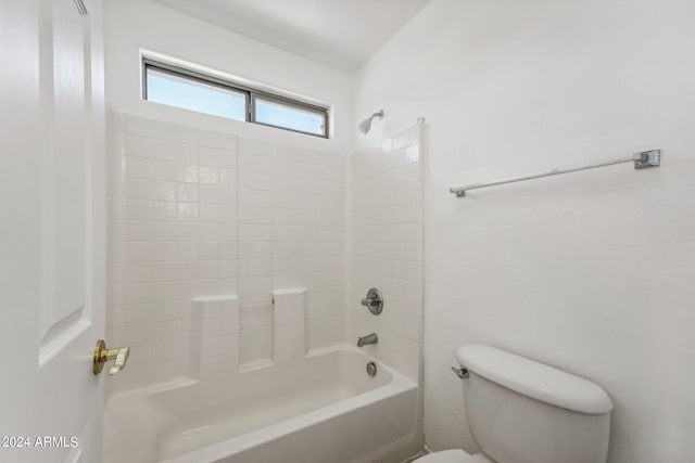 bathroom with washtub / shower combination and toilet