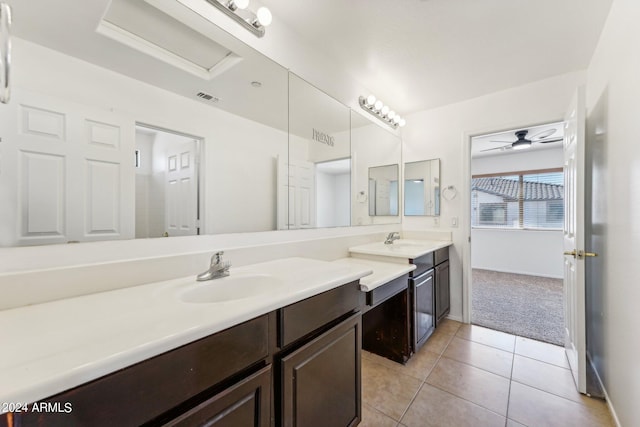 bathroom with ceiling fan, vanity, and tile patterned flooring