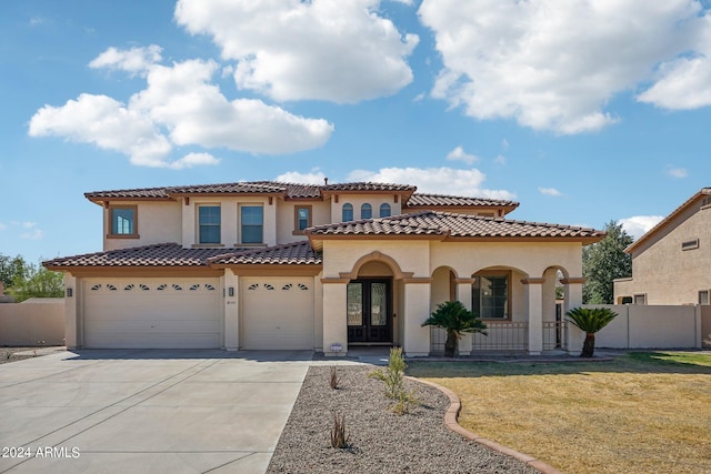 mediterranean / spanish-style home with a garage, a porch, and a front lawn