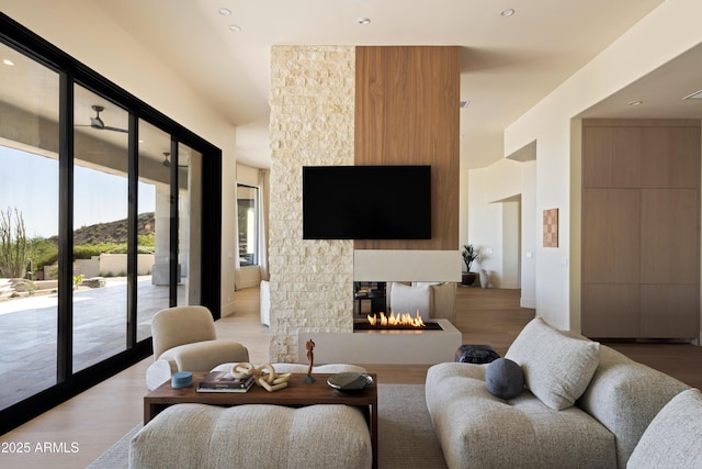 12887 N 135th St, Scottsdale, AZ 85259 - living room with light wood-style floors, a multi sided fireplace, and recessed lighting