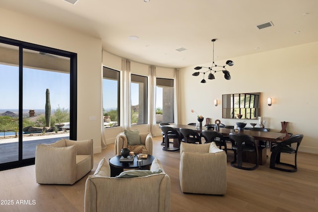 12887 N 135th St, Scottsdale, AZ 85259 - living room with light wood finished floors and a chandelier