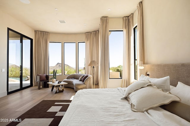 12887 N 135th St, Scottsdale, AZ 85259 - bedroom with access to outside, wood finished floors, and a mountain view