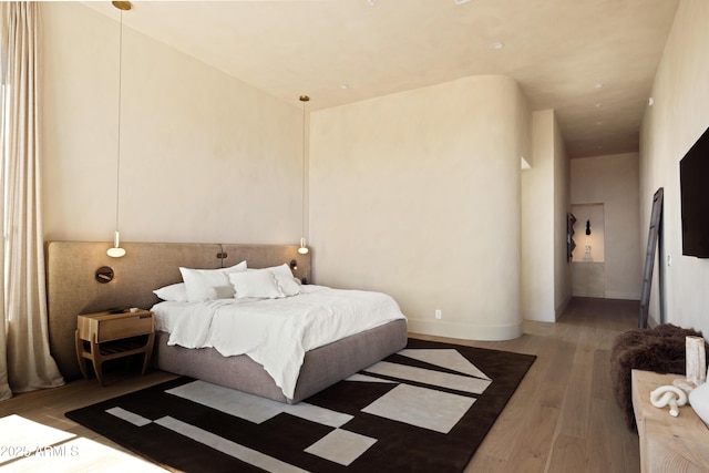 12887 N 135th St, Scottsdale, AZ 85259 - bedroom featuring wood finished floors and a towering ceiling
