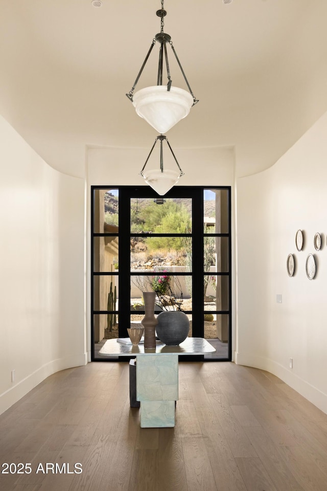 12887 N 135th St, Scottsdale, AZ 85259 - unfurnished dining area with wood finished floors and baseboards