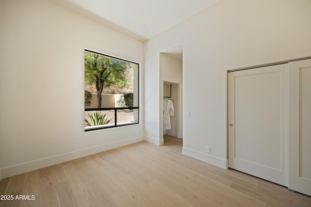 12887 N 135th St, Scottsdale, AZ 85259 - unfurnished bedroom with light wood-style flooring and a closet