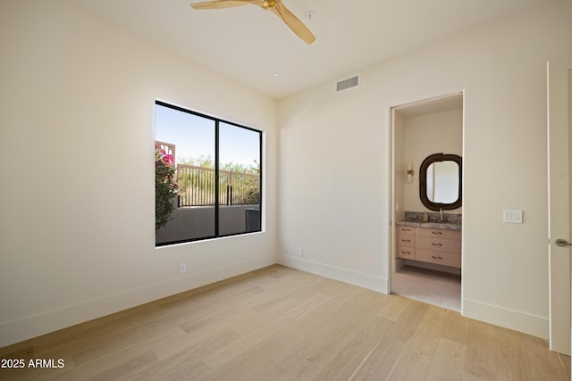 12887 N 135th St, Scottsdale, AZ 85259 - unfurnished bedroom with light wood-style floors, ensuite bath, and ceiling fan