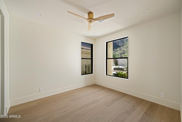 12887 N 135th St, Scottsdale, AZ 85259 - unfurnished room featuring light wood-type flooring, a ceiling fan, and recessed lighting