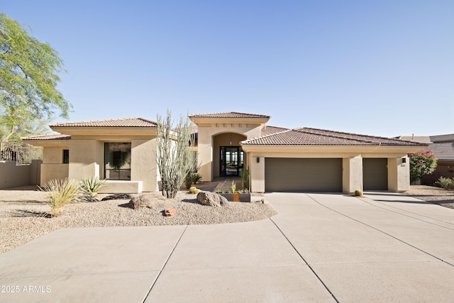 12887 N 135th St, Scottsdale, AZ 85259 - mediterranean / spanish home featuring stucco siding, an attached garage, driveway, and a tiled roof