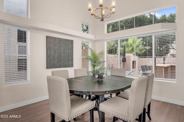 1574 E Scott Ave, Gilbert, AZ 85234 - dining room with a chandelier, a high ceiling, and wood finished floors