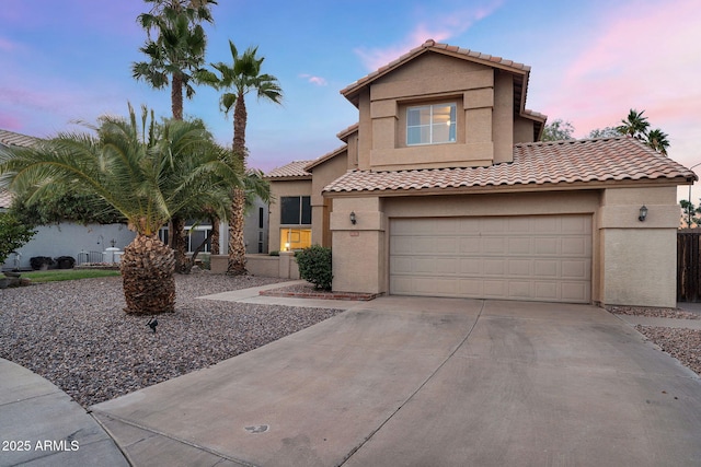 1574 E Scott Ave, Gilbert, AZ 85234 - mediterranean / spanish home featuring stucco siding, concrete driveway, a garage, and a tiled roof