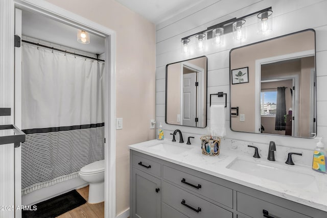 1574 E Scott Ave, Gilbert, AZ 85234 - bathroom with double vanity, wood finished floors, and a shower with shower curtain