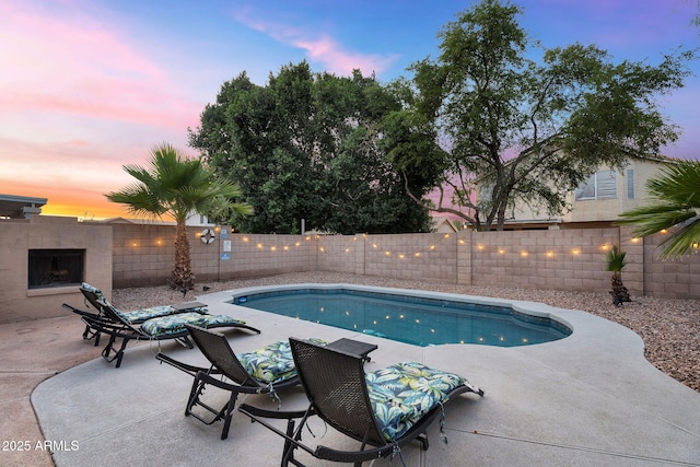 1574 E Scott Ave, Gilbert, AZ 85234 - pool at dusk with a patio and a fenced backyard