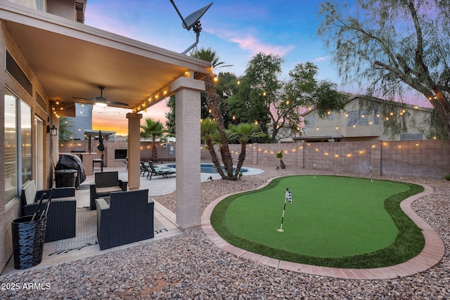 1574 E Scott Ave, Gilbert, AZ 85234 - view of community featuring a putting area, a patio area, and a fenced backyard