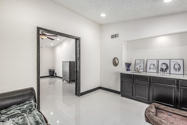 4020 W Anderson Dr, Glendale, AZ 85308 - kitchen with dark cabinets, light countertops, recessed lighting, a textured ceiling, and ceiling fan
