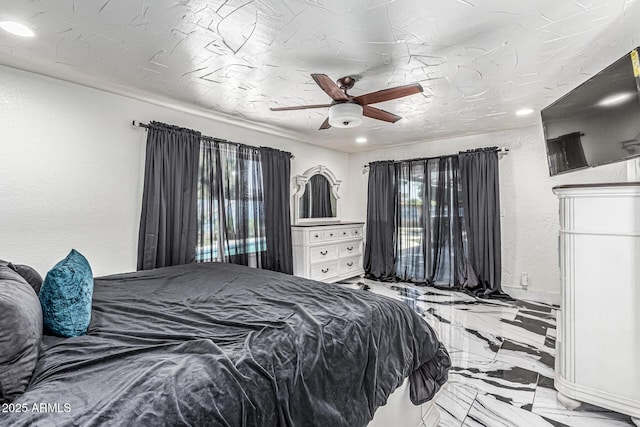 4020 W Anderson Dr, Glendale, AZ 85308 - bedroom with marble tiled floors, a textured wall, recessed lighting, and ceiling fan