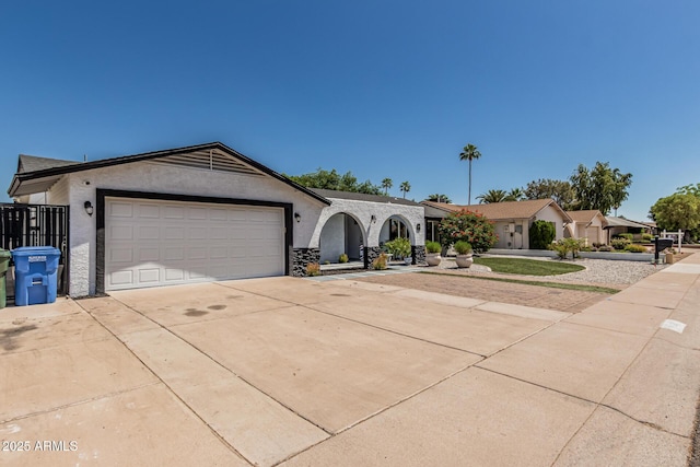 4020 W Anderson Dr, Glendale, AZ 85308 - ranch-style home featuring concrete driveway, stucco siding, an attached garage, and stone siding