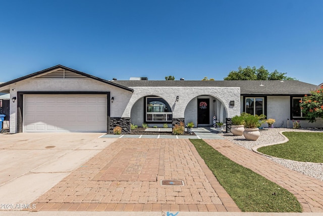 4020 W Anderson Dr, Glendale, AZ 85308 - ranch-style home featuring concrete driveway, stucco siding, a garage, and stone siding