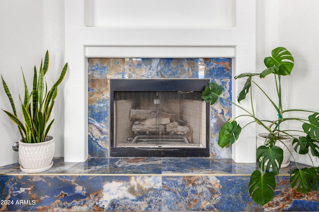 details featuring a tile fireplace