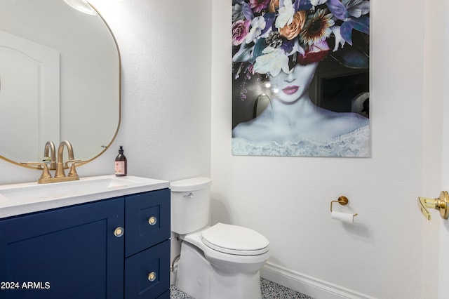 bathroom featuring oversized vanity and toilet