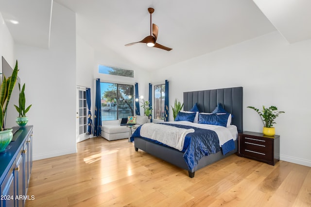 bedroom with high vaulted ceiling, ceiling fan, and light hardwood / wood-style flooring