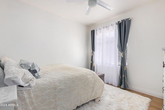 bedroom featuring ceiling fan and light hardwood / wood-style flooring