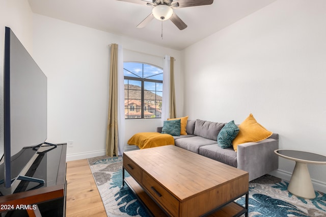 living room with ceiling fan and light hardwood / wood-style floors