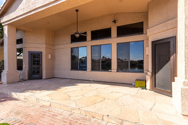 view of patio featuring ceiling fan