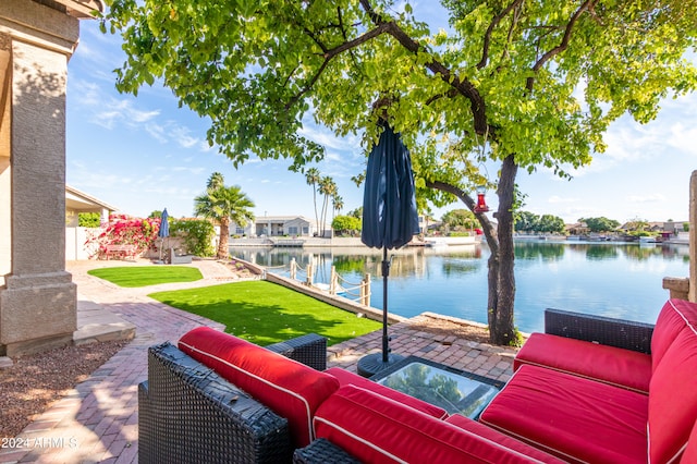 view of patio with a water view and an outdoor hangout area