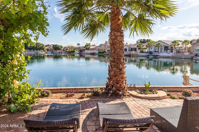 view of patio featuring a water view